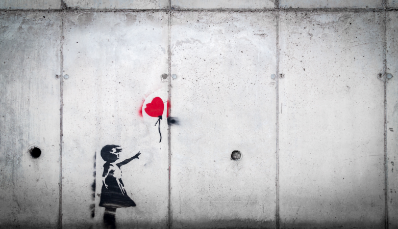 girl in black dress and red balloon